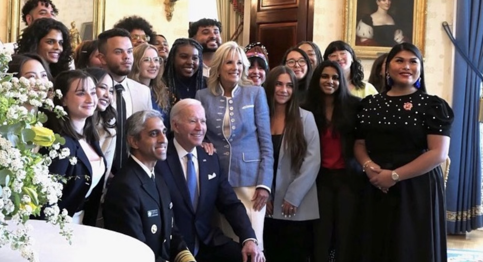 A group of young activists taking a picture with First Lady Dr Jill Biden, Surgeon General Dr Murthy and the President of the United States Joe Biden